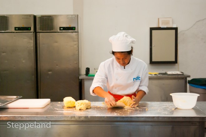 ROC student kneading dough